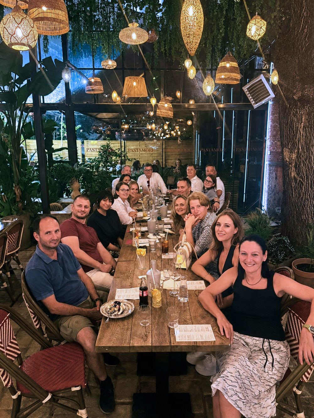 The Spirity team together at a long table during a company dinner